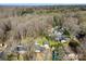 Aerial view of neighborhood including houses, trees, and swimming pools at 1438 Ridgewood Dr, Gastonia, NC 28054