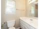 Bathroom features a large mirror, a window for natural light, and a toilet at 1569 Brentfield Dr, Rock Hill, SC 29732