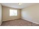Cozy bedroom with neutral walls, carpet flooring, and natural light at 1569 Brentfield Dr, Rock Hill, SC 29732