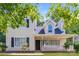 Charming two-story home with covered porch, black shutters, and manicured front yard at 1569 Brentfield Dr, Rock Hill, SC 29732