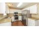 The kitchen is equipped with stainless steel appliances, white cabinetry, and granite countertops at 1569 Brentfield Dr, Rock Hill, SC 29732