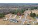 Overhead view of a charming house nestled within a wooded neighborhood at 1587 Berkshire Dr, Newton, NC 28658
