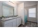 Bathroom featuring double sinks, granite countertops, and a shower with a blue curtain at 1587 Berkshire Dr, Newton, NC 28658