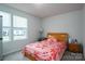 Bedroom with plush carpet, two windows and a floral comforter with matching pillow at 1587 Berkshire Dr, Newton, NC 28658