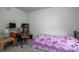 Cozy bedroom featuring a work area and a comfortable twin bed with purple floral bedding at 1587 Berkshire Dr, Newton, NC 28658