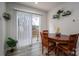 Cozy dining area with natural light, wood table and chairs, adjacent to sliding glass doors offering outdoor views at 1587 Berkshire Dr, Newton, NC 28658