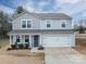 Charming two-story home with a welcoming front porch and a two-car garage at 1587 Berkshire Dr, Newton, NC 28658