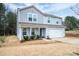 Charming house featuring a welcoming front porch and landscaped yard at 1587 Berkshire Dr, Newton, NC 28658