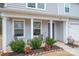 Charming home's inviting porch with seating and well-manicured landscaping at 1587 Berkshire Dr, Newton, NC 28658