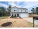 Two-story home with a well-kept front yard, featuring inviting porch seating at 1587 Berkshire Dr, Newton, NC 28658