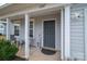 Close up of the entrance, showing the 'Welcome' sign, and covered porch at 1587 Berkshire Dr, Newton, NC 28658