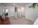 Upstairs hallway with light walls, plush carpeting and a safety gate for safety at 1587 Berkshire Dr, Newton, NC 28658
