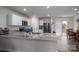 Modern kitchen featuring granite countertops, stainless steel appliances, and a breakfast bar overlooking the dining area at 1587 Berkshire Dr, Newton, NC 28658