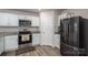 Well-equipped kitchen with stainless steel appliances, ample storage, and modern finishes for a stylish cooking experience at 1587 Berkshire Dr, Newton, NC 28658