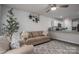 Comfortable living room featuring a sofa, neutral walls, and adjacent kitchen space for seamless living at 1587 Berkshire Dr, Newton, NC 28658