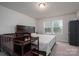 Cozy bedroom with a large bed, dark wood furniture, and two windows for natural light at 1587 Berkshire Dr, Newton, NC 28658