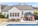 Exterior view of backyard with swimming pool, patio, gazebo, and well-maintained landscaping at 162 Pecan Hills Dr, Mooresville, NC 28115