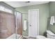 Neutral bathroom featuring a glass enclosed tile shower, and towel racks at 162 Pecan Hills Dr, Mooresville, NC 28115
