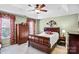 Spacious bedroom with hardwood floors, ceiling fan, and windows for natural light at 162 Pecan Hills Dr, Mooresville, NC 28115