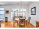 Cozy dining area with hardwood floors, chandelier and decorative, wrought iron chairs at 162 Pecan Hills Dr, Mooresville, NC 28115