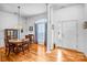 Bright dining room with hardwood floors, white columns, and ample natural light at 162 Pecan Hills Dr, Mooresville, NC 28115