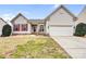 Charming home with a well-manicured lawn, red shutters, and a two-car garage at 162 Pecan Hills Dr, Mooresville, NC 28115