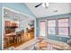 View of living areas, including a kitchen and sunroom with lots of natural light at 162 Pecan Hills Dr, Mooresville, NC 28115