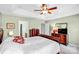 Spacious main bedroom with tray ceiling, ceiling fan, and elegant wood furniture at 162 Pecan Hills Dr, Mooresville, NC 28115