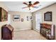 Office space with a wooden dresser, carpet flooring, ceiling fan, and natural light at 162 Pecan Hills Dr, Mooresville, NC 28115
