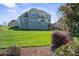 Well-manicured backyard, showcasing a spacious lawn and mature landscaping at 190 Hidden Meadows Dr, Mooresville, NC 28117