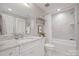 Well-lit bathroom with granite countertop vanity, shower over tub and neutral tiling at 190 Hidden Meadows Dr, Mooresville, NC 28117