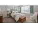 Bright bedroom featuring a comfy bed, stylish decor, and a window with natural light at 190 Hidden Meadows Dr, Mooresville, NC 28117