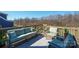 Cozy outdoor deck area with comfortable seating and a wooded view, perfect for relaxing and entertaining at 190 Hidden Meadows Dr, Mooresville, NC 28117