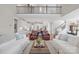 Open concept living space features a view to the kitchen, staircase, and comfortable seating at 190 Hidden Meadows Dr, Mooresville, NC 28117