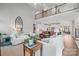 Bright and open living space with high ceilings, multiple seating areas, and view to kitchen at 190 Hidden Meadows Dr, Mooresville, NC 28117