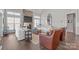 Bright living room features large windows, a stone fireplace, and modern, comfortable seating at 190 Hidden Meadows Dr, Mooresville, NC 28117