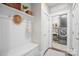 Functional mud room with wainscoting, built-in bench, and access to the laundry room at 190 Hidden Meadows Dr, Mooresville, NC 28117
