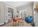 Inviting home office featuring hardwood floors, natural light, an accent chair, and neutral walls at 190 Hidden Meadows Dr, Mooresville, NC 28117