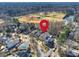 Aerial view of the property and surrounding neighborhood with close proximity to nearby baseball fields at 2004 Lombardy Cir, Charlotte, NC 28203