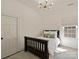 Bright bedroom features a twin bed, a window, and a dark wooden bed frame at 2004 Lombardy Cir, Charlotte, NC 28203