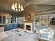 Stylish living room with gray walls, a marble fireplace, wet bar and two large windows at 2004 Lombardy Cir, Charlotte, NC 28203