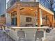 Stylish outdoor bar area with seating, sink, and beer tap overlooking the lounge at 2004 Lombardy Cir, Charlotte, NC 28203