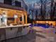 An amazing poolside bar area with bar seating and an adjacent outdoor living area at 2004 Lombardy Cir, Charlotte, NC 28203