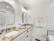 Elegant bathroom featuring double sinks, granite countertops, and arched mirrors at 2009 Charlotte Dr, Charlotte, NC 28203