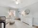 Light and airy Bedroom featuring a crib, chair, dresser, and round decorative mirror at 2009 Charlotte Dr, Charlotte, NC 28203