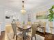 Dining room with view to kitchen and living room at 2009 Charlotte Dr, Charlotte, NC 28203
