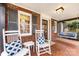 Charming front porch with rocking chairs and swing, perfect for relaxing at 2009 Charlotte Dr, Charlotte, NC 28203
