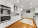 Modern kitchen with stainless appliances and hardwood floors at 2009 Charlotte Dr, Charlotte, NC 28203
