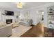Spacious living room featuring a fireplace, hardwood floors, and neutral decor at 2009 Charlotte Dr, Charlotte, NC 28203