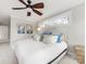 Cozy bedroom featuring a comfortable king bed, ceiling fan and bright natural light at 2009 Charlotte Dr, Charlotte, NC 28203